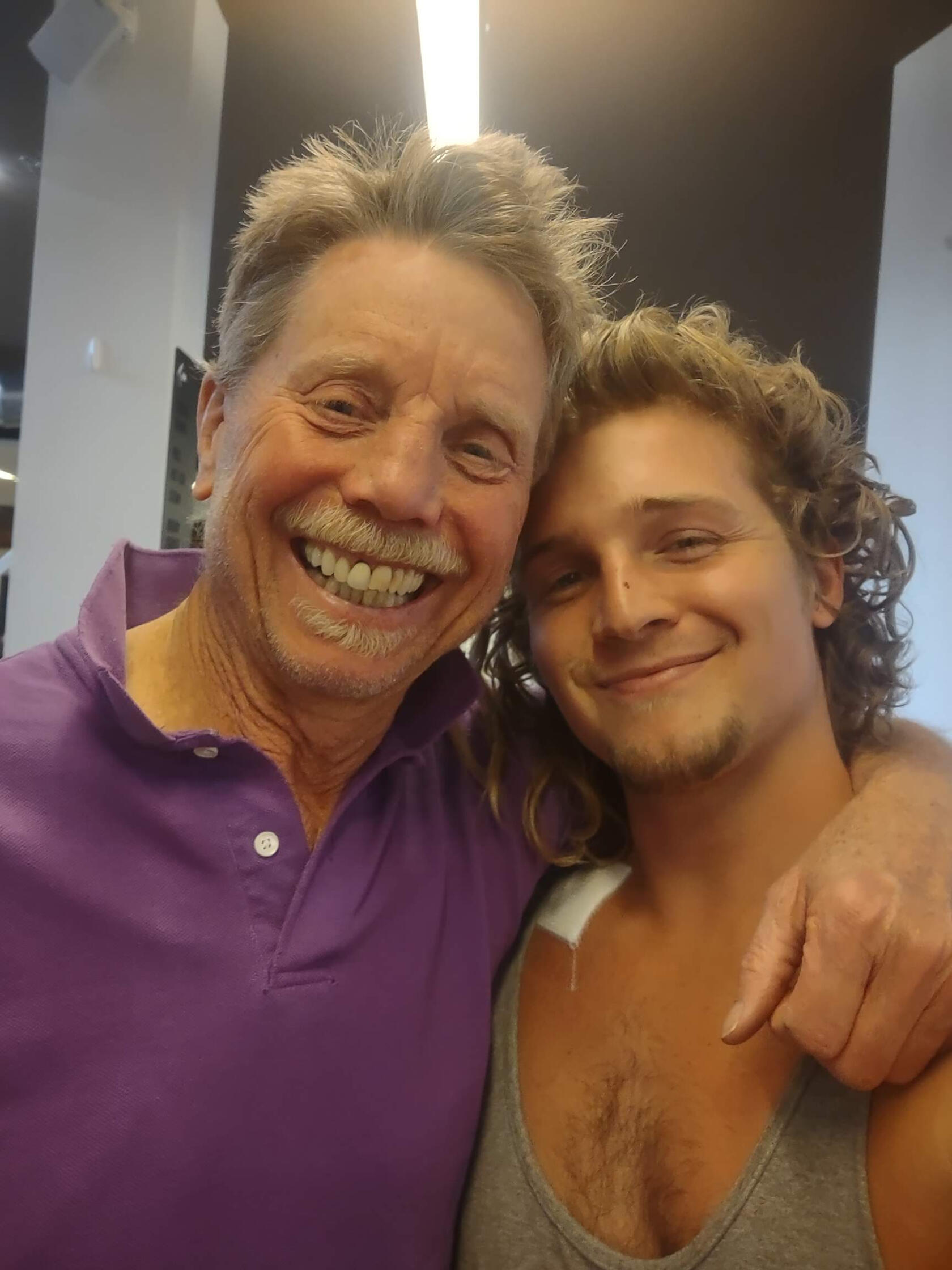 Tommy King Two men smiling and fit