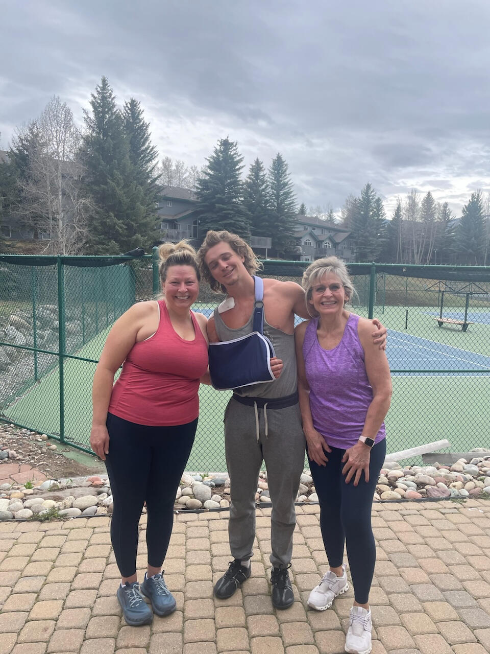 Tennis club Two women with their personal trainer